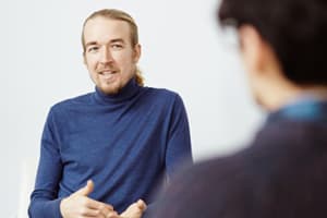 counselor discusses treatment options with male patient