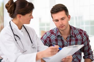 Treatment for Xanax Abuse Female portraying doctor speaking with male patient about treatment for xanax addiction