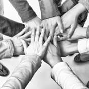 rehabs-shutter180191942-woman-support-group-hands-stacked