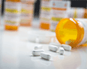 Prescription pills spilled on table