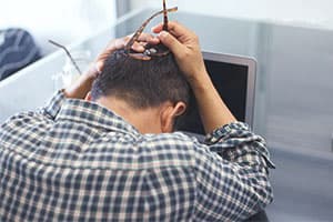 frustrated man at computer