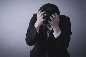 man suffering from naltrexone side effects